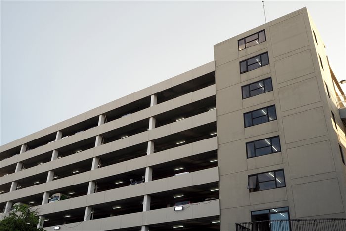 Upward view of a multi-story concrete parking deck